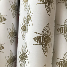 Bee wrapping paper in gold